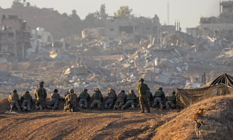 Israeli soldiers take positions near the Gaza border.