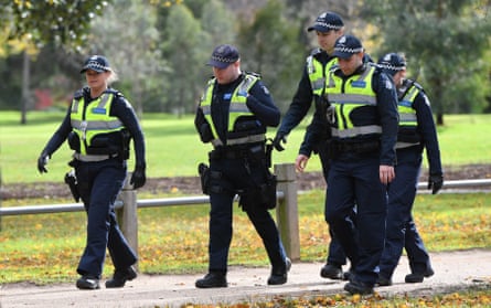 Police on patrol near a growing makeshift memorial for Eurydice Dixon at the Princes Park.