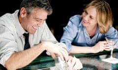 George Clooney and Vera Farmiga sitting at a bar