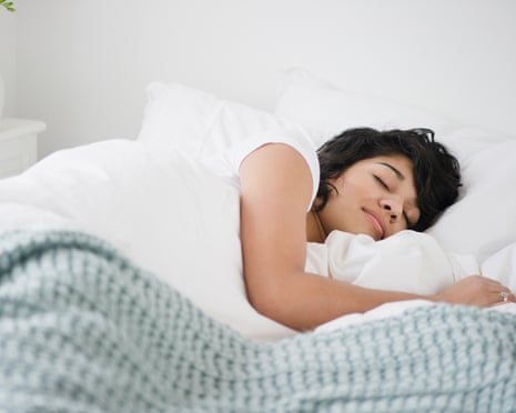 Hispanic woman sleeping in bed – posed by model