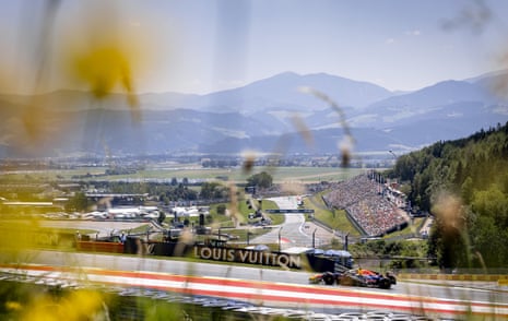 Max Verstappen during free practice at the Red Bull Ring with hills in the background.