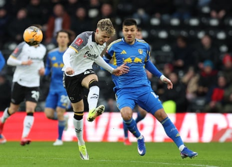 It’s party time as Joel Piroe takes on Derby County’s Bobby Clark.