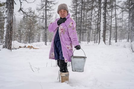 Traditionally in the taiga, the wife of a reindeer herder is responsible for bringing firewood and water
