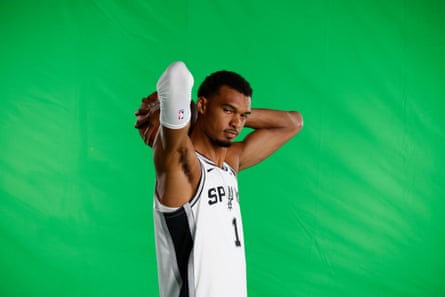 Victor Wembanyama poses for photos during the Spurs’ media day at the Victory Capital Performance Center in San Antonio.