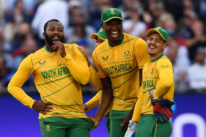 Andile Phehlukwayo of South Africa (left) celebrates taking the wicket of Dawid Malan with his team-mates.
