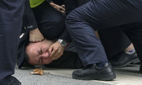 A protester is pinned down by police officers during a protest against China’s zero-Covid policy in Shanghai  last Sunday.