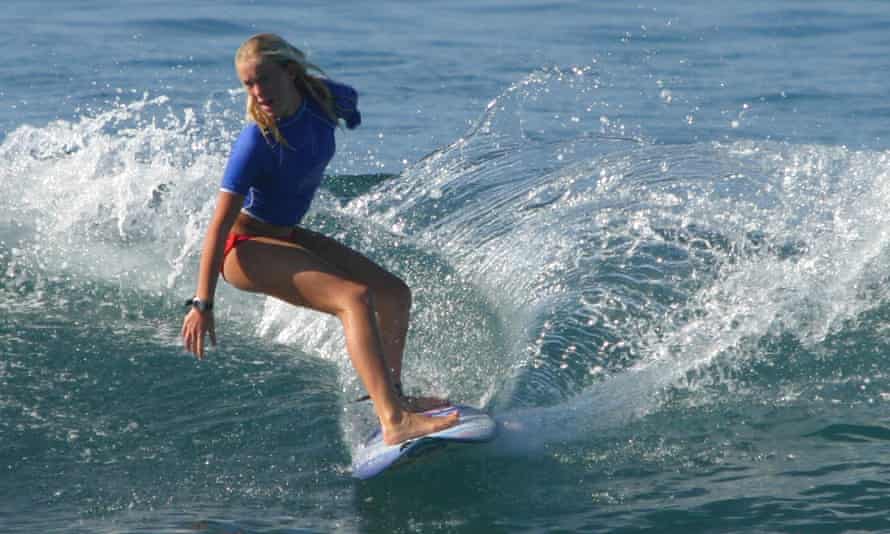 Bethany Hamilton rides a wave during the NSSA tournament in Hawaii in 2004, her first competition after losing her left arm.