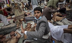Wounded anti-government protesters lie on the ground as they receive medical help at a field hospital during clashes with security forces in Sanaa, Yemen, in 2011. 