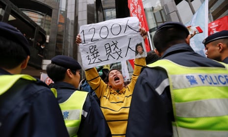 A protester holds a banner with the picture of Carrie Lam, who has been voted in as Hong Kong’s next chief executive.