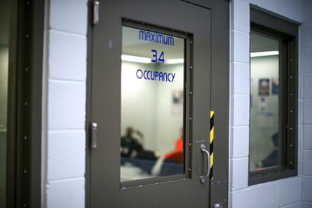 people sit in a cell