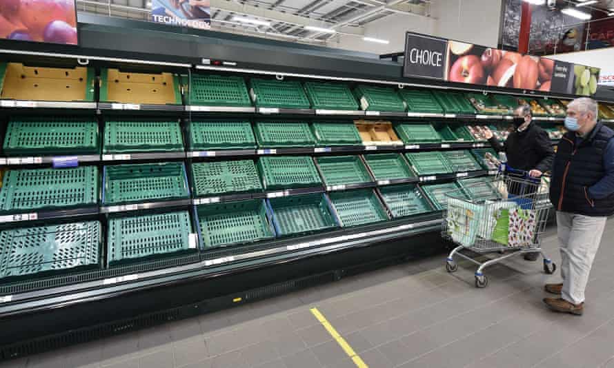 Shoppers in Belfast faced with empty supermarket shelves earlier this year.