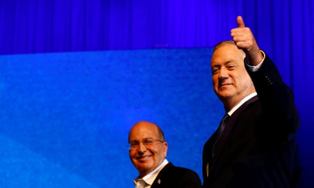 Blue and White party leader Benny Gantz gestures as he stands next to co-leader Moshe Yaalon after exit polls announced in Israel’s election at the party’s headquarters in Tel Aviv, Israel 3 March 2020. 