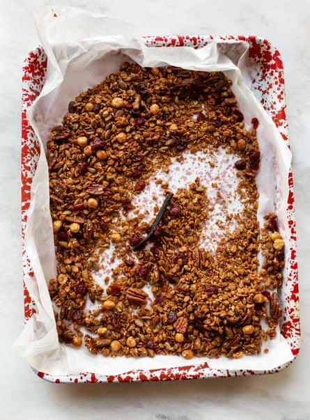 Granola on a red and white tray