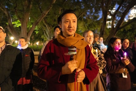 A man spun a Buddhist prayer wheel during gathering in Hyde Park to remember the life of Bikram Lama.