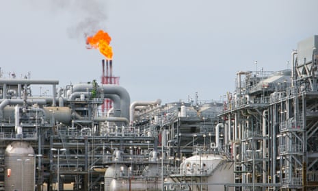 A flame blazes on top of flare stacks at the Queensland Curtis Liquefied Natural Gas site