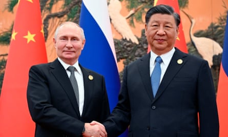 Chinese President Xi Jinping, R, and Russian President Vladimir Putin.