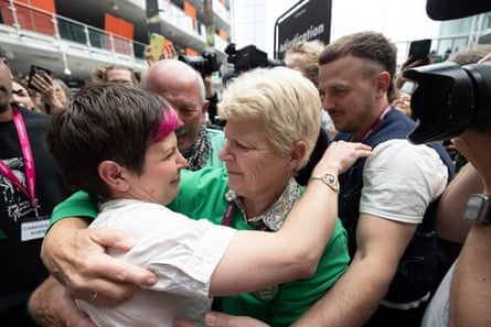 Garbett embracing her mother, with her father behind.