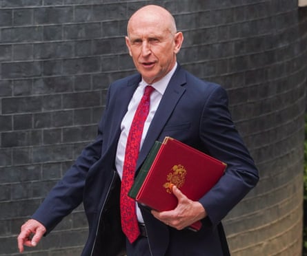 John Healey with a red folder outside Downing Street