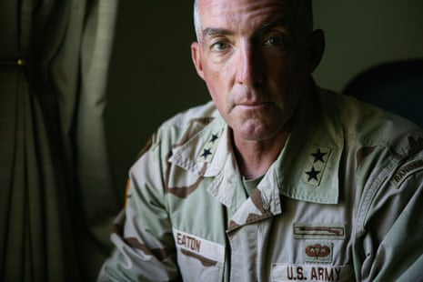 a man in military fatigues looks ahead