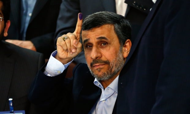 Former Iranian president Mahmoud Ahmadinejad shows his inked finger after registering his candidacy at the interior ministry in Tehran for the forthcoming election. 