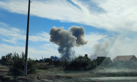 Smoke rises after explosions were heard from the direction of a Russian military airbase near Novofedorivka, Crimea, on 9 August.