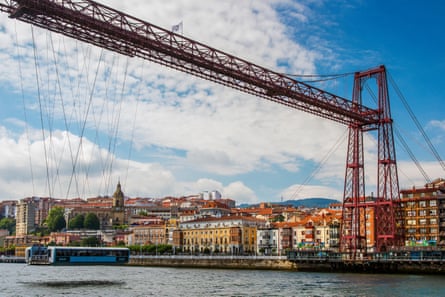 Transporter bridge across a broad river in a town