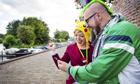 People playing the new game Pokémon Go on their smartphone in Leerdam, The Netherlands. 