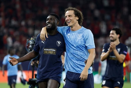 Pafos players Derrick Luckassen and David Luiz celebrate their hard-earned point in Greece.
