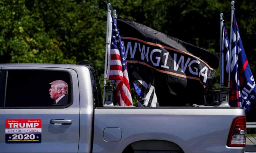 Pro-Trump flags and a flag reading WWG1WGA, a reference to the QAnon slogan in Adairsville, Georgia.