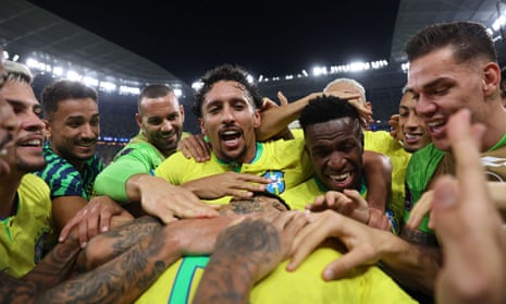 Brazil's Casemiro celebrates scoring their first goal with teammates.