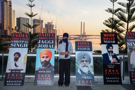 Sikh independence activists protest outside Marvel Stadium.