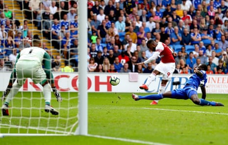 Alexandre Lacazette of Arsenal scores his team’s third goal past Neil Etheridge of Cardiff City.