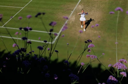 Marta Kostyuk in the distance with flowers in the foreground