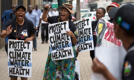 Campaigners outside South Africa’s Pretoria high court during the country’s first climate change lawsuit