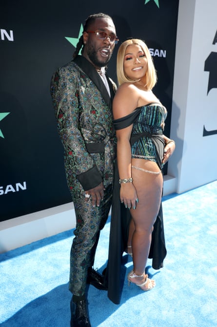 With his partner, British R&B star Stefflon Don.