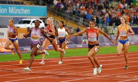 Switzerland's Mujinga Kambundji crosses the line ahead of Britain’s Dina Asher-Smith to win gold in the 200m