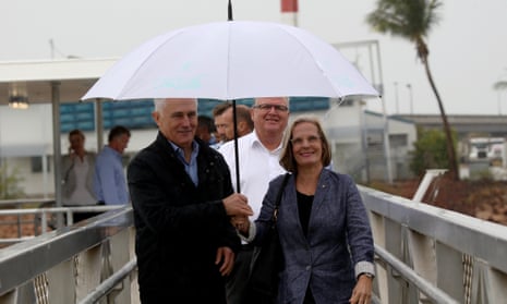 A rainy reef trip. Malcolm and Lucy Turnbull, and the Herbert MP Ewen Jones, disembark after a brief boat trip to Magnetic Island.