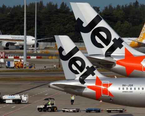 Jetstar aircrafts sit on the tarmac