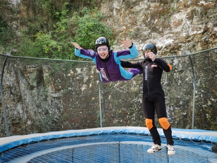 A woman floats in an controlled aerodrome.