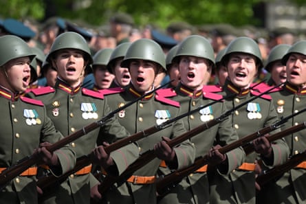 Russian servicemen wearing Soviet-era uniforms march on Red Square during the Victory Day parade in Moscow
