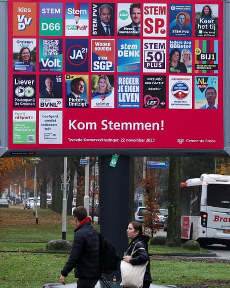 Election campaign posters on a hoarding in BredaPeople walk past election campaign posters on a hoarding in Breda, Netherlands, November 21, 2023.