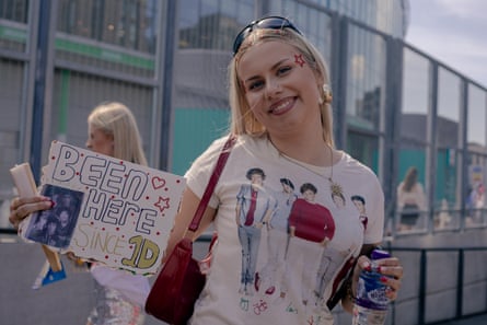 A Harry Styles fan queues up at Wembley Stadium.