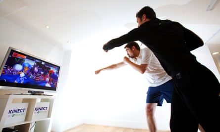 Our faithful games correspondent Keith, in white, trying out the Kinect in 2000.