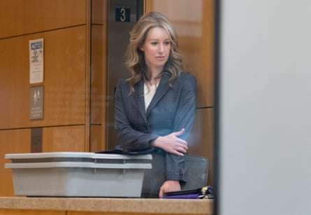Elizabeth Holmes wears a grey tailored jacket in court.