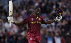 West Indies’ Carlos Brathwaite celebrates reaching his century.