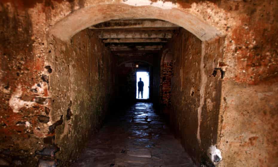 A man is silhouetted against the ‘Door of No Return’ at the House of Slaves on Goree Island near Senegal’s capital, Dakar.