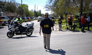 An FBI agent walks towards the crime scene of the first explosion. The second explosion occurred about five miles south of the dayâs first blast.