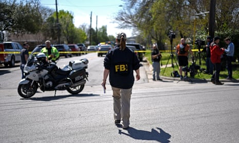 An FBI agent walks towards the crime scene of the first explosion. The second explosion occurred about five miles south of the day’s first blast.