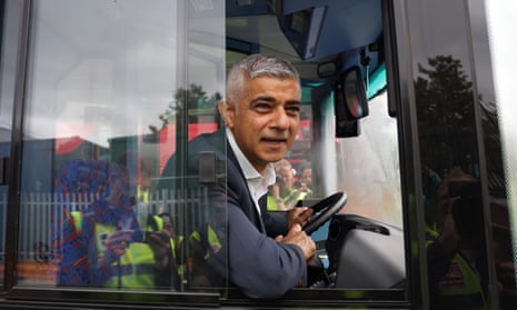 Sadiq Khan in driver's seat of a bus