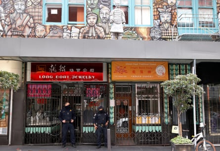 Officers patrol in San Francisco’s Chinatown.
